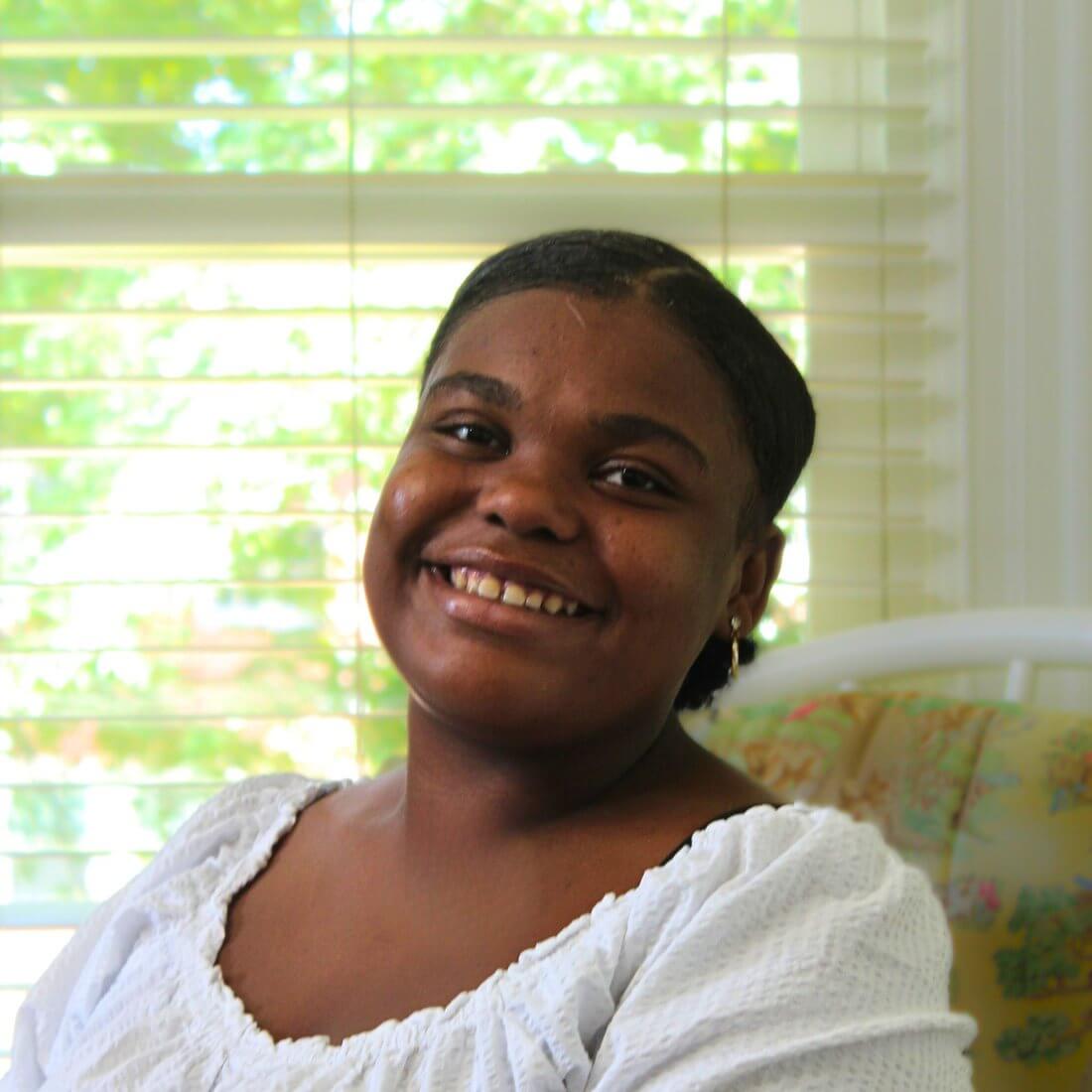 A resident at Room At The Inn, at home and at ease