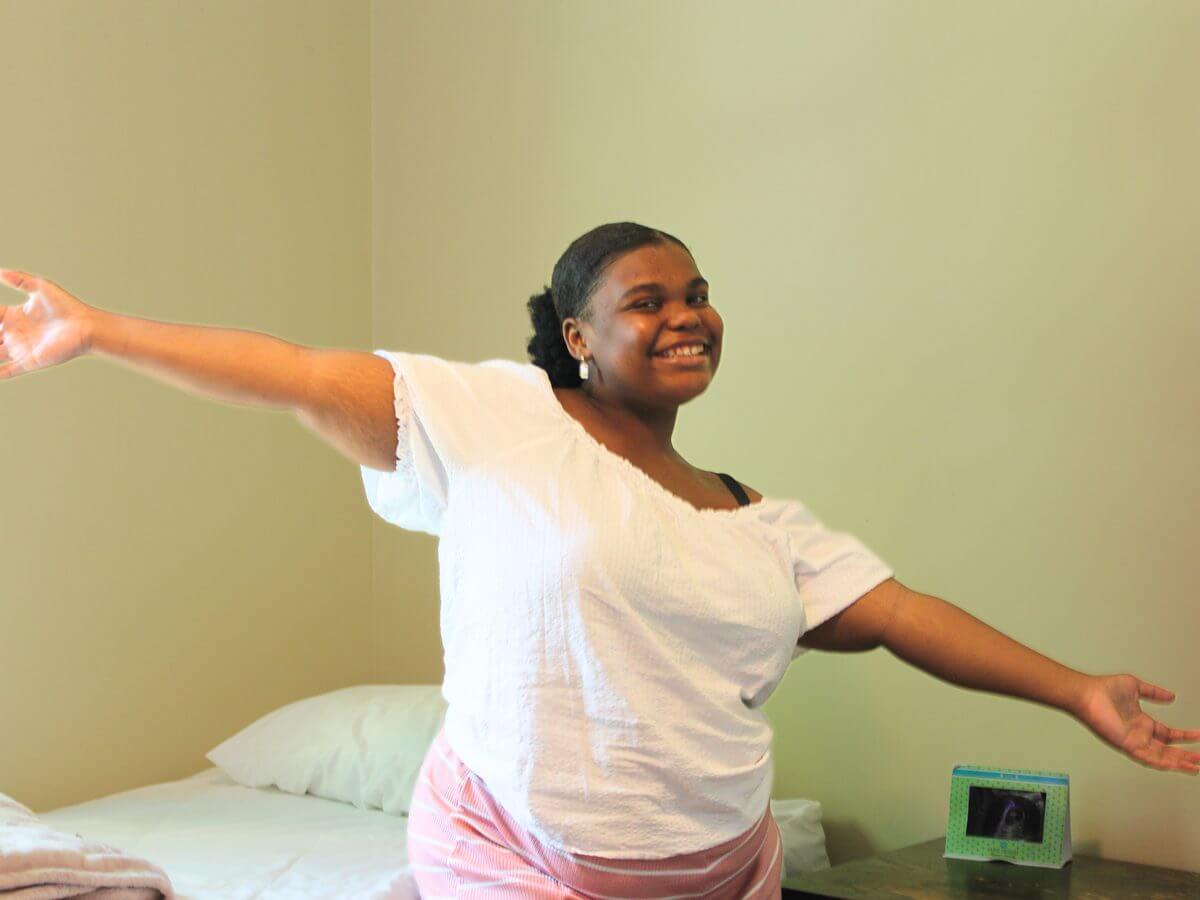 A resident showing her room at the Nussbaum Maternity Shelter