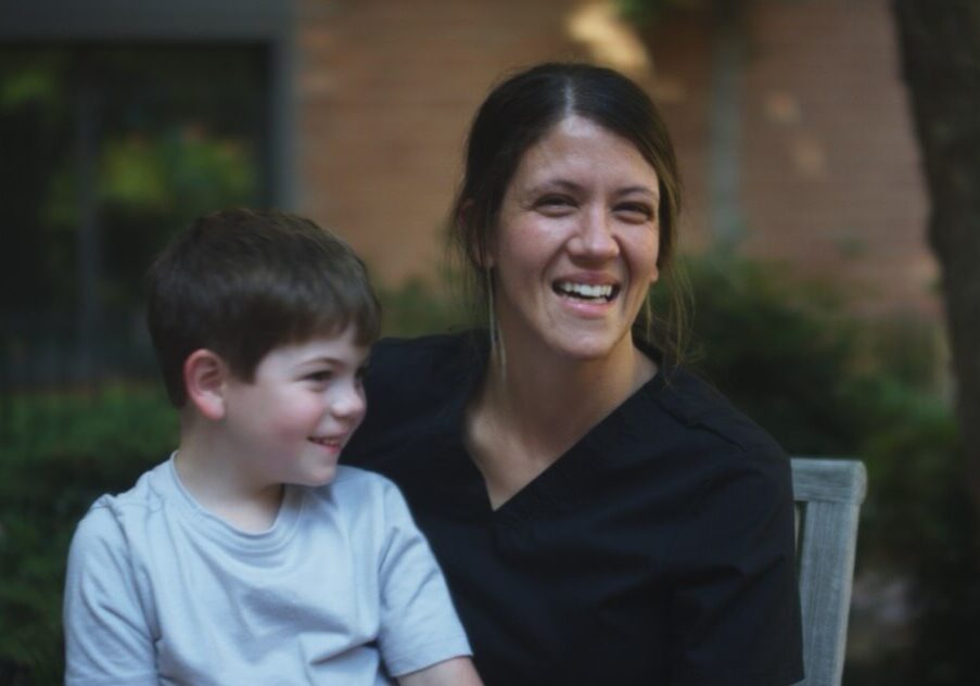 A caregiver with a child