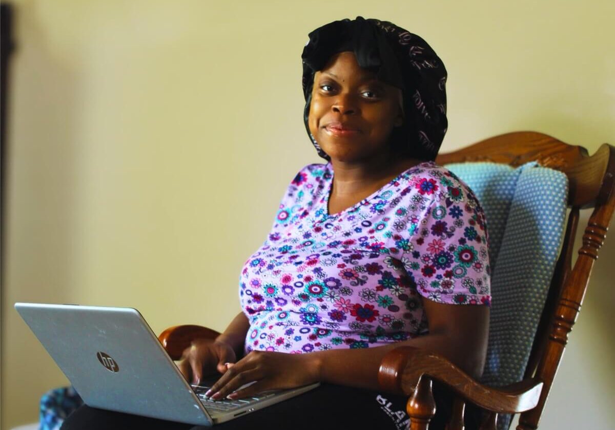 A resident working on a laptop